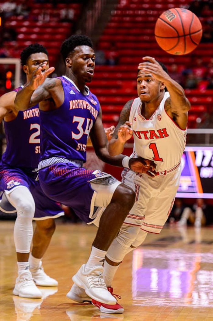 (Trent Nelson | The Salt Lake Tribune)  Utah Utes guard Justin Bibbins (1) defended by Northwestern State Demons forward Brandon Hutton (34) as the University of Utah hosts Northwestern State, NCAA basketball in Salt Lake City, Wednesday December 20, 2017.