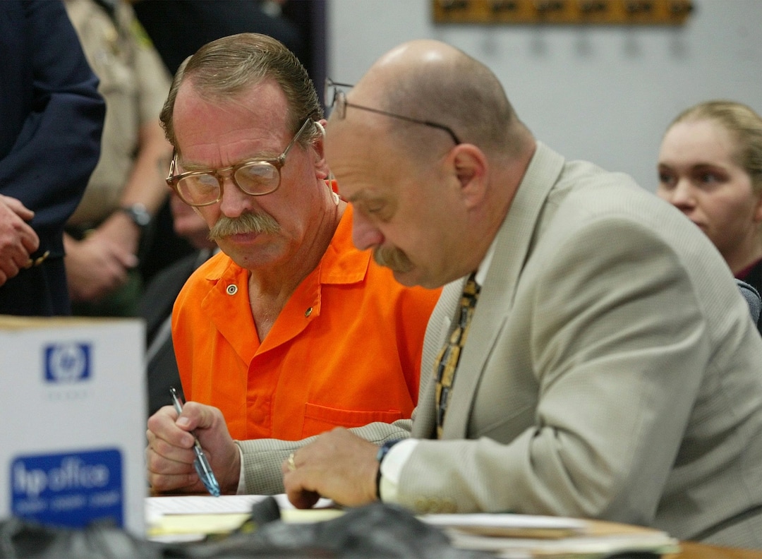 (Stuart Johnson  |  AP pool) Ron Lafferty, left, and Ron Yengich, Laffertys new defense attorney review the official notice proclaiming Yengich as Laffertys new attorney, Wednesday, Sept. 25, 2002, in Provo, Utah. Lafferty who is on death row for his part in killing his sister-in-law and baby niece July 24, 1984.