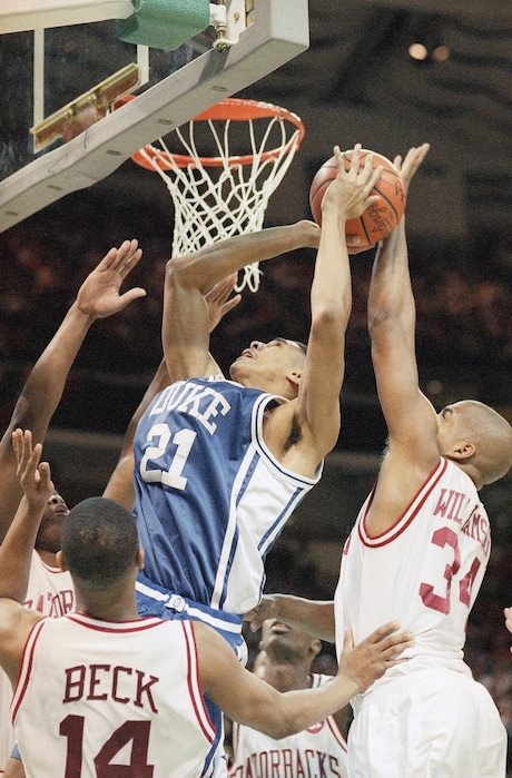 Dukes Antonio Lang gets his shot blocked by Arkansas Corliss Williamson, right, during the first half of the Final Four championship game, Monday, April 4, 1994, Charlotte, N.C. (AP Photo/Bob Jordan)