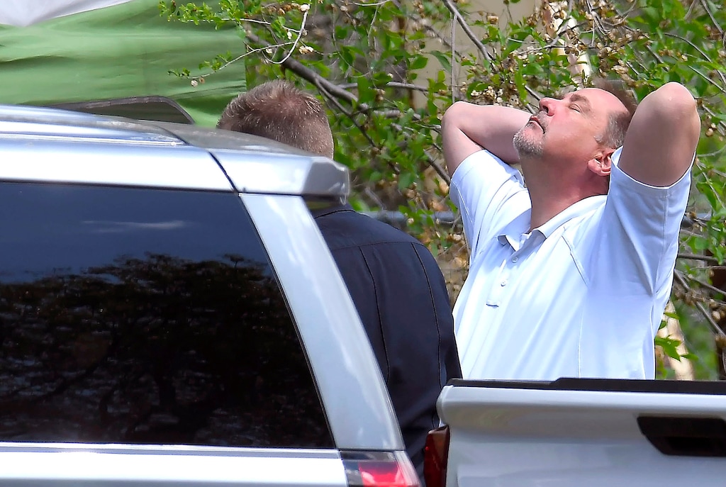 (Eli Lucero | Herald Journal via AP) Lt. Rod Peterson puts his hands on his head at the scene where a body that they believe to be Elizabeth Shelley was found on Wednesday, May 25, 2019, in Logan, Utah. The 5-year-old girl went missing from her home on Saturday May 25, and her uncle, Alexander Whipple has been charged with her murder.