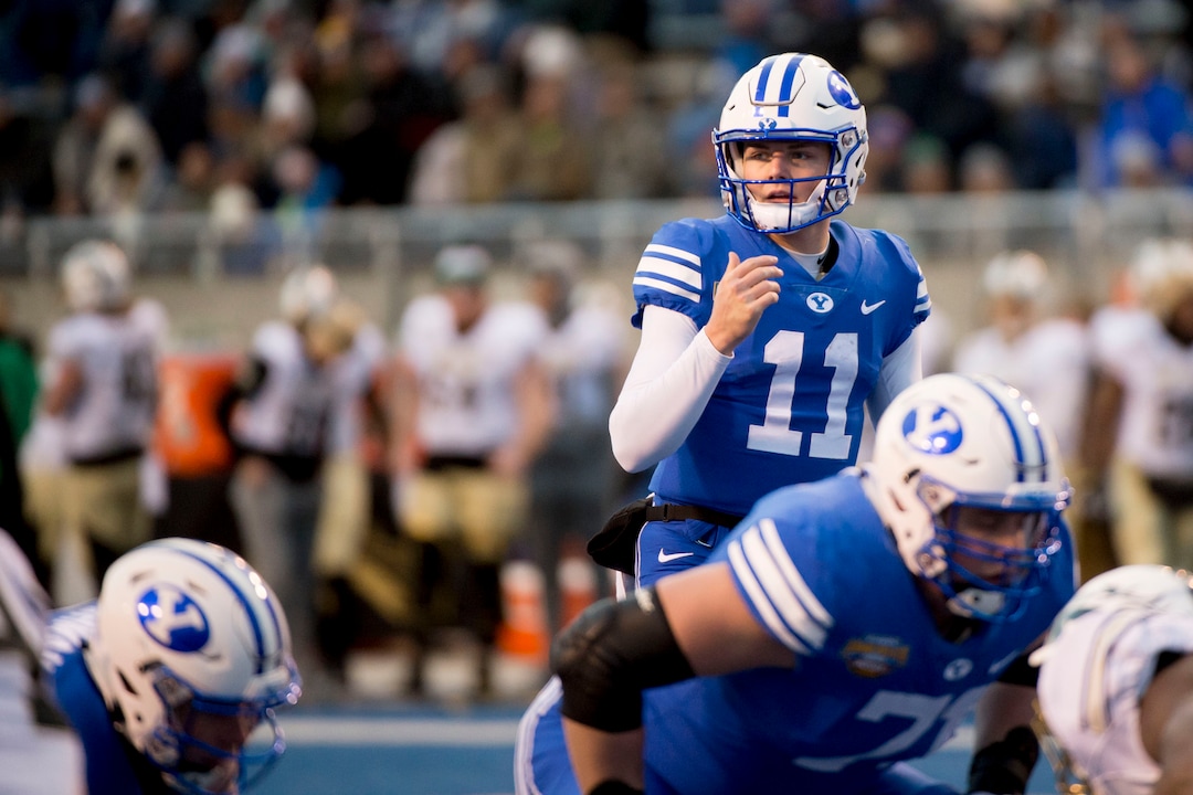 (Jeremy Harmon  |  The Salt Lake Tribune) Brigham Young Cougars quarterback Zach Wilson (11) helms his team as BYU faces the Western Michigan Broncos in the Famous Idaho Potato Bowl in Boise, Idaho, on Friday, Dec. 21, 2018.