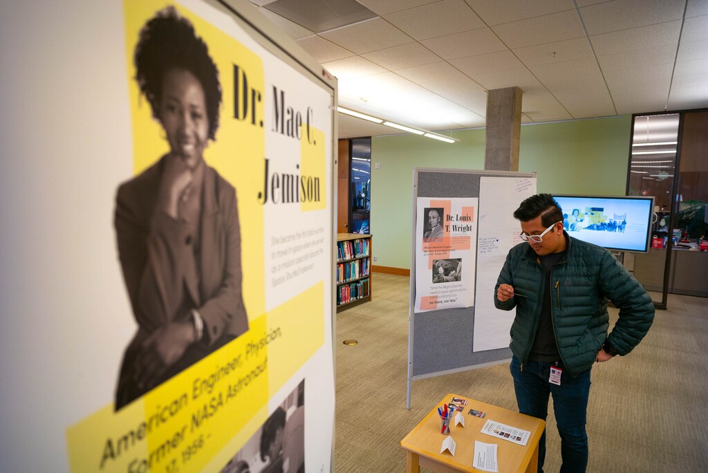 (Trent Nelson  |  The Salt Lake Tribune) Mauricio Laguan looks over an interactive exhibit highlighting six figures in African American history at the University of Utah's Eccles Health Sciences Library in Salt Lake City on Thursday, Feb. 20, 2020.