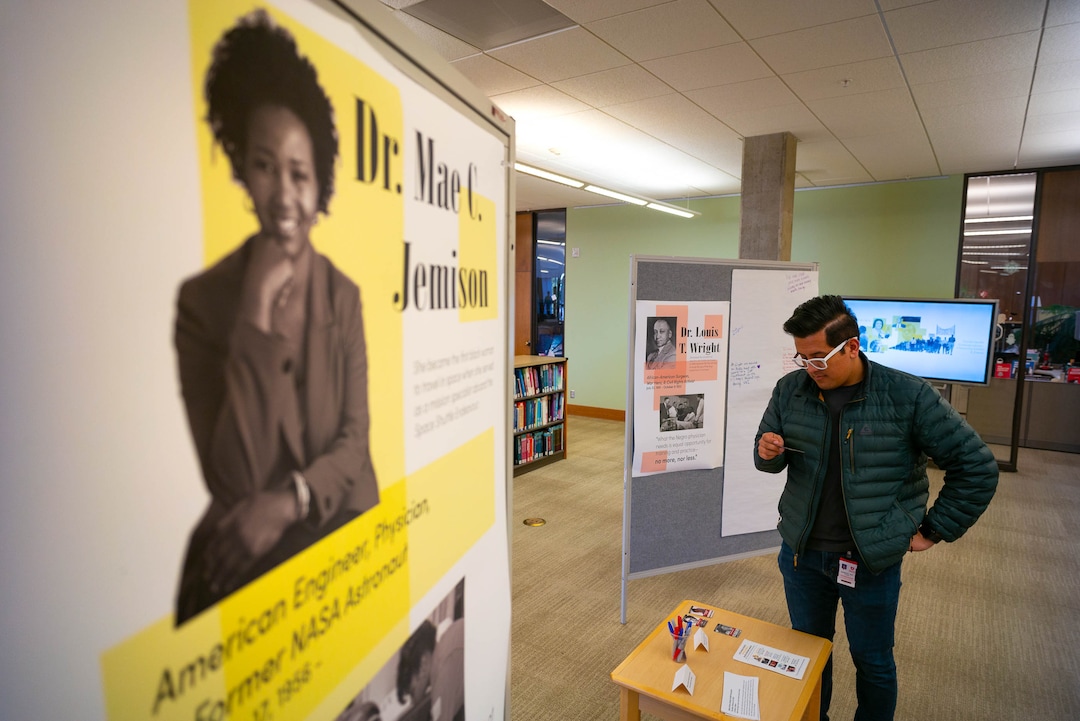 (Trent Nelson  |  The Salt Lake Tribune) Mauricio Laguan looks over an interactive exhibit highlighting six figures in African American history at the University of Utah's Eccles Health Sciences Library in Salt Lake City on Thursday, Feb. 20, 2020.