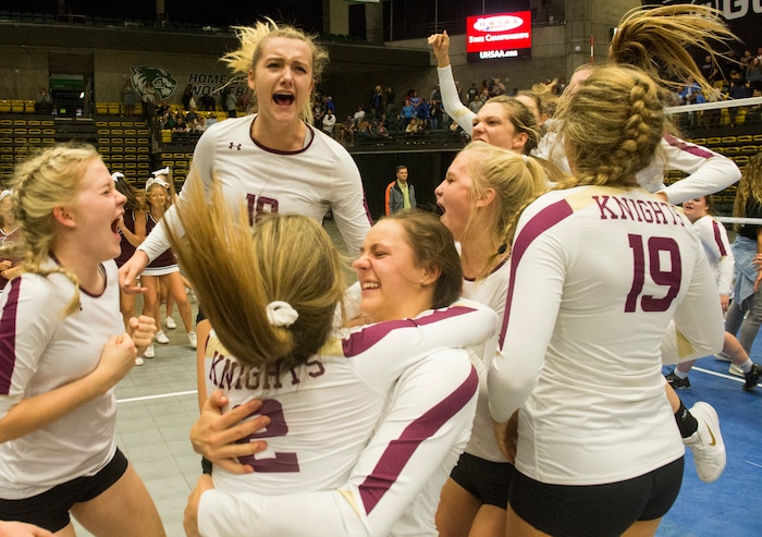 (Rick Egan  |  The Salt Lake Tribune)    The Lone Peak Knights celebrate their win over the Pleasant Grove Vikings, for the 6A volleyball championship, at Utah Valley University, Saturday, November 4, 2017.