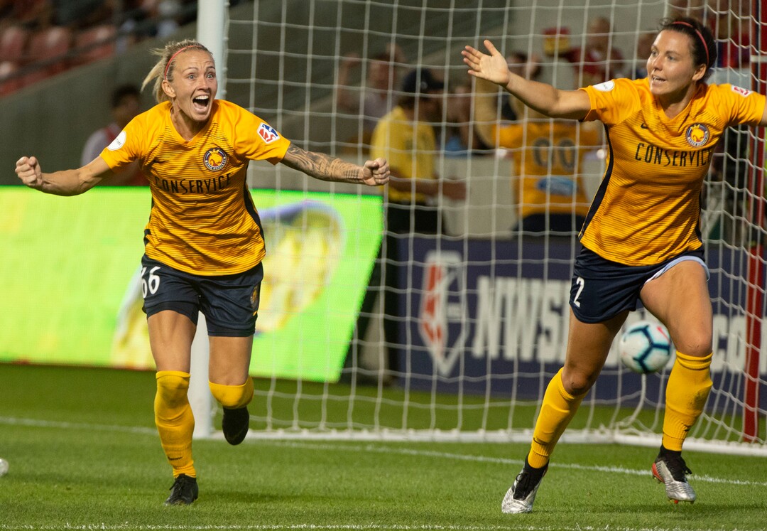 (Rick Egan  |  The Salt Lake Tribune)    Utah Royals FC midfielder Gunnhildur Jónsdóttir (66) celebrates after Utah Royals FC defender Rachel Corsie (2) scored the game tying goal, in Soccer action between Utah Royals FC and Portland Thorns FC, in Sandy, Friday, July 19, 2019.