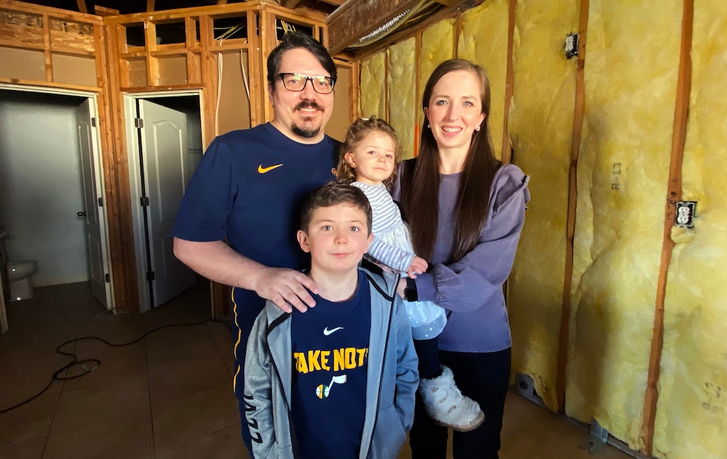 (Rick Egan | The Salt Lake Tribune) The Peterson family, Mikey and Karie, with their kids Stockton and Meg, stand in their kitchen, which was heavily damaged by a fire. Thursday, Feb. 25, 2021.