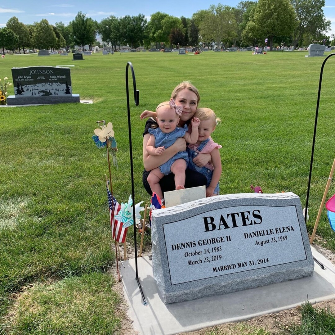 (Photo courtesy of Dani Bates) Dani Bates with her daughters Piper, left, and Winnie at Denny Bates' grave.