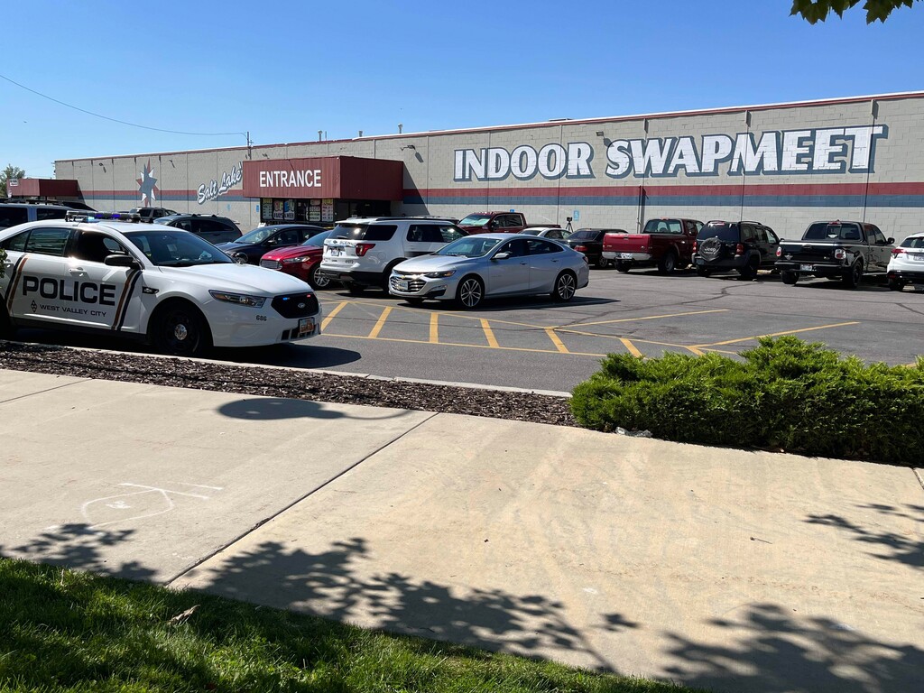 (Andy Larsen | The Salt Lake Tribune) Police vehicles are shown parked near the scene of a shooting in West Valley City on Sunday, Aug. 7, 2022.