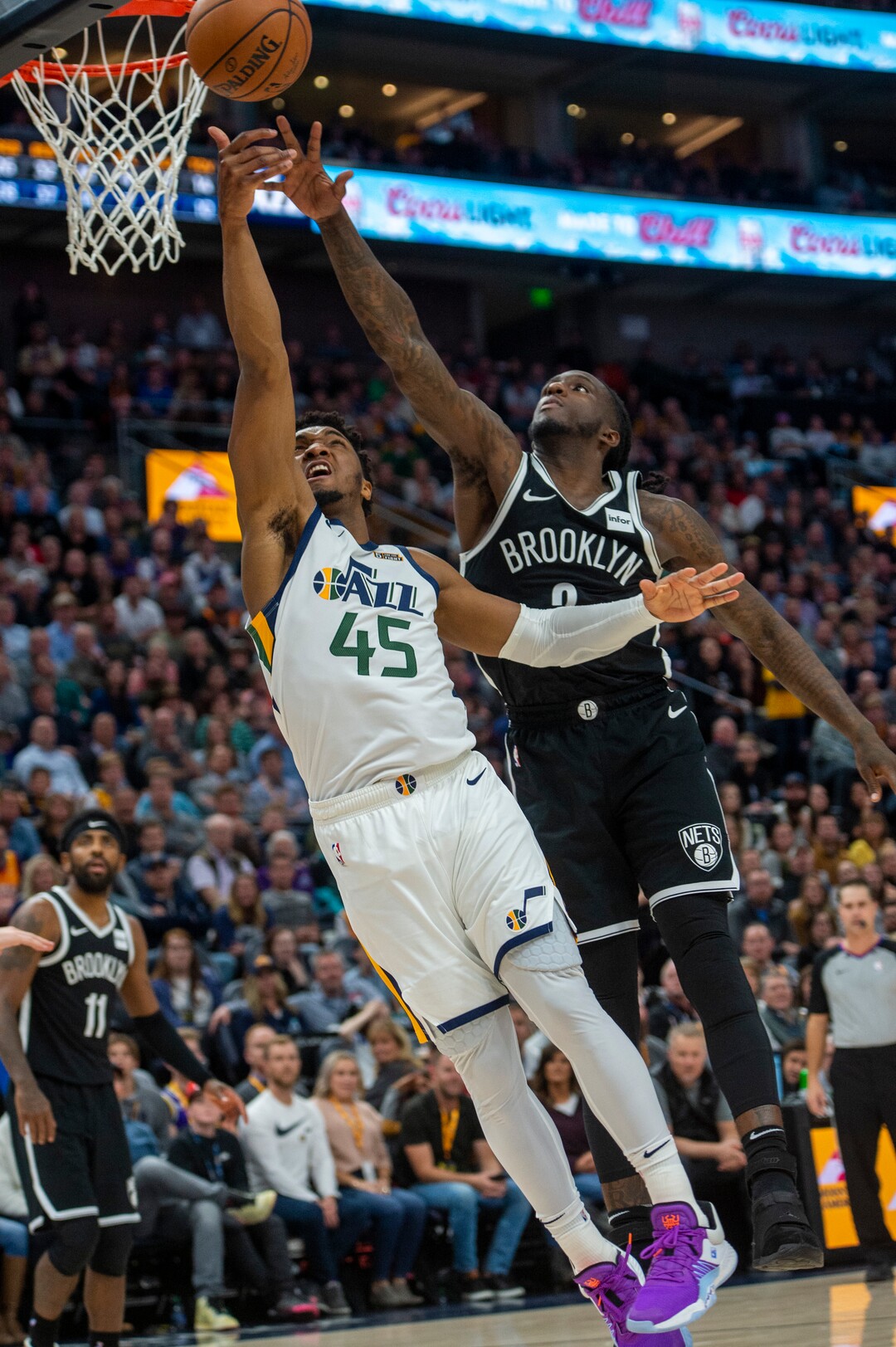(Rick Egan  |  The Salt Lake Tribune)        Utah Jazz guard Donovan Mitchell (45) scores as Brooklyn Nets guard Spencer Dinwiddie (8) defends, in NBA basketball action between the Utah Jazz and the Brooklyn Nets in Salt Lake City, Tuesday, Nov 12, 2019.