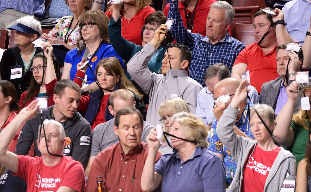 (Leah Hogsten  |  The Salt Lake Tribune) l-r Frustrations and weariness show on the faces of delegates as the convention drags on due to rigorous debate on bylaws, amendment proposals and rules at the Utah Republican Nominating Convention Saturday, April 21, 2018 at the Maverik Center. 