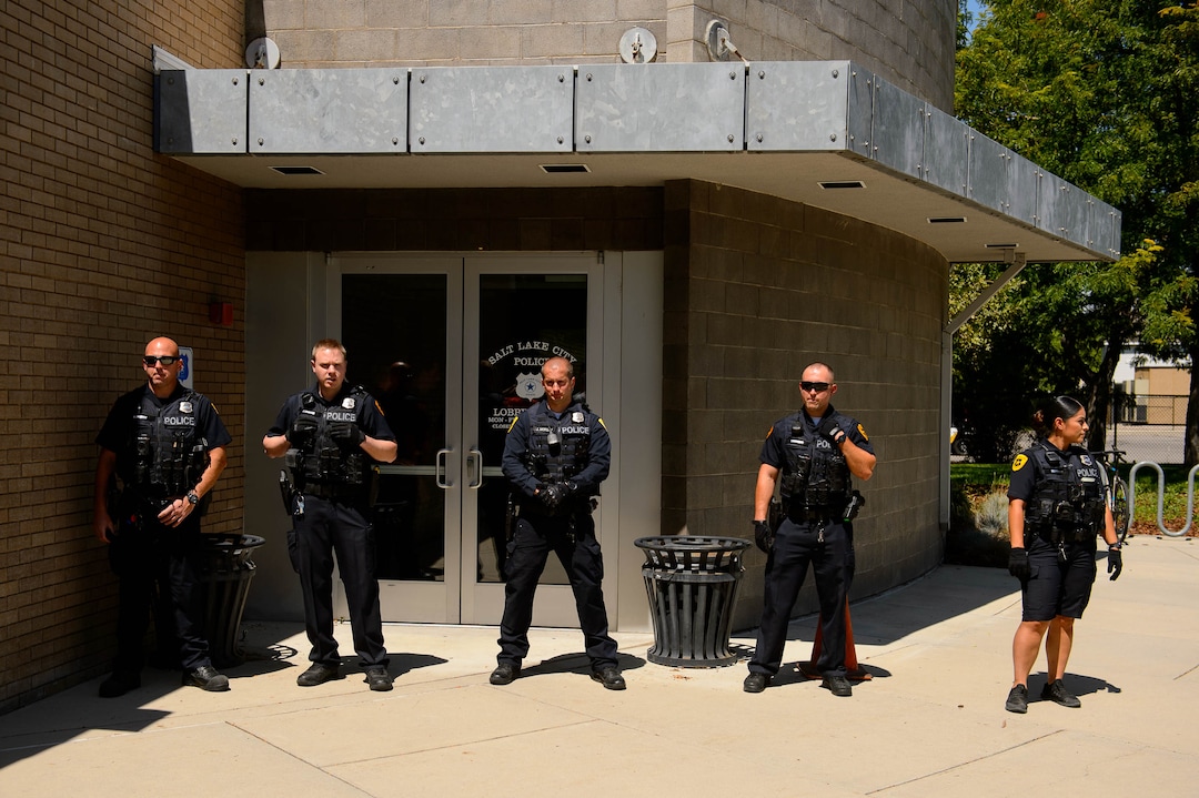 (Trent Nelson  |  The Salt Lake Tribune)  Police stand guard after a meeting of an inland port satellite working group was quickly canceled. The meeting was held at a police precinct in Salt Lake City on Wednesday Aug. 14, 2019.