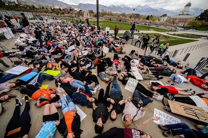 (Trent Nelson | The Salt Lake Tribune)  
High school students staged a die-in at the Utah State Capitol in Salt Lake City to mark the anniversary of the Columbine High School massacre and call for action against gun violence, Friday April 20, 2018.