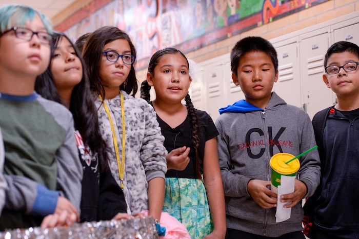 (Leah Hogsten  |  The Salt Lake Tribune) Ekssyria Hernandez, center, talks about the project with her classmates. Students at Parkview Elementary have created a treasure with trash. Ten fifth graders in Cher Sten's extended learning program or ELP class, molded school and household plastic refuse into a mosaic to send the message: "Consume Less" to their classmates. The idea for the mural began after a discussion about global warming, climate issues, plastic pollution and its implications on earth.