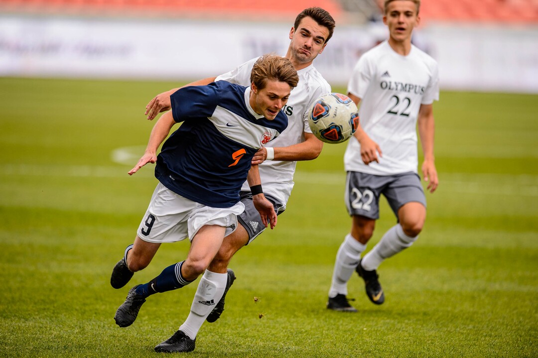 (Trent Nelson  |  The Salt Lake Tribune)  Brighton's Alex Fankhauser (9) and Olympus's Logan Davies (2) as Olympus faces Brighton High School in the 5A boys state championship game at Rio Tinto Stadium in Sandy, Thursday May 23, 2019.