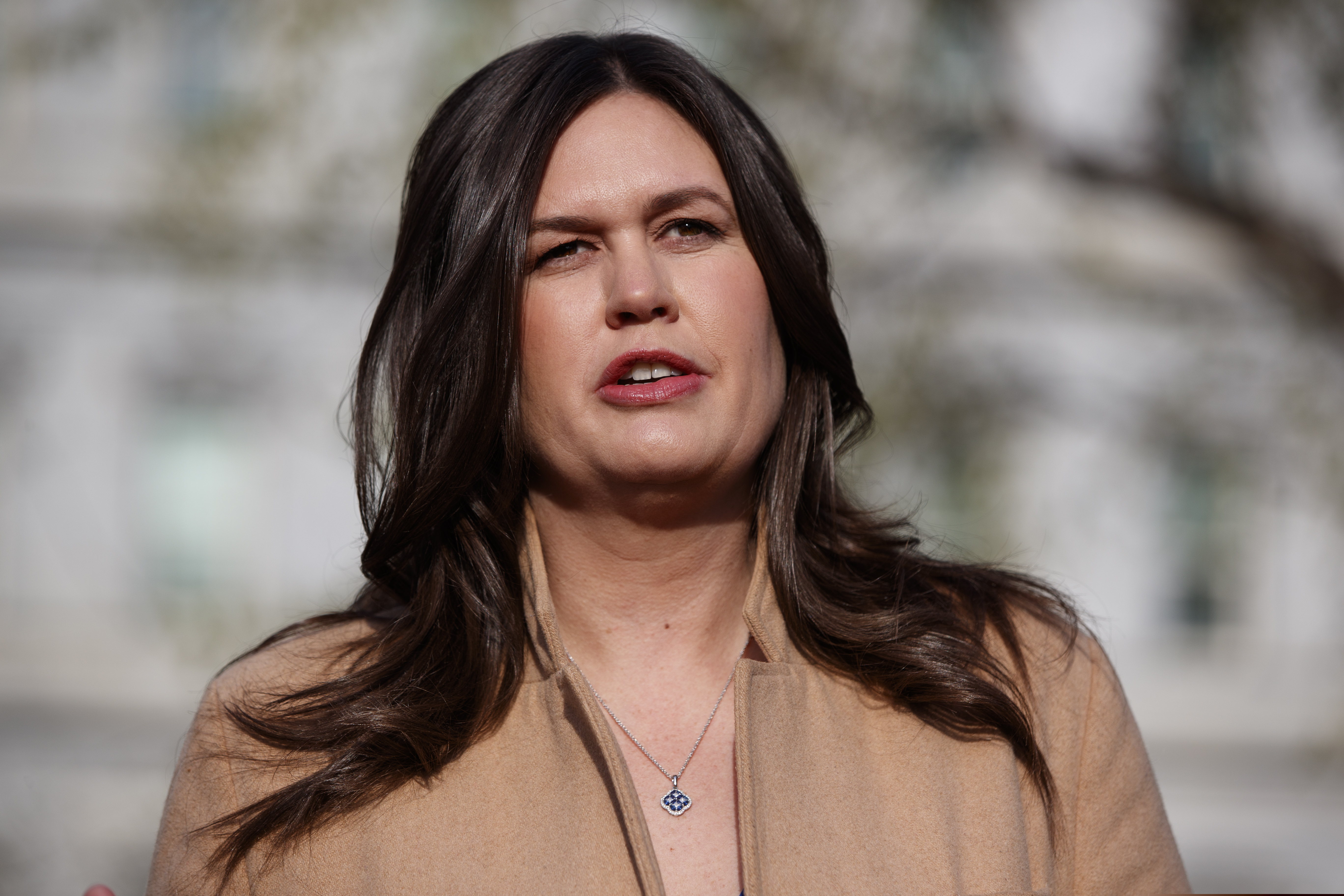 (AP Photo/Evan Vucci, File) In this April 4, 2019, file photo, White House press secretary Sarah Sanders talks with reporters outside the White House in Washington.
