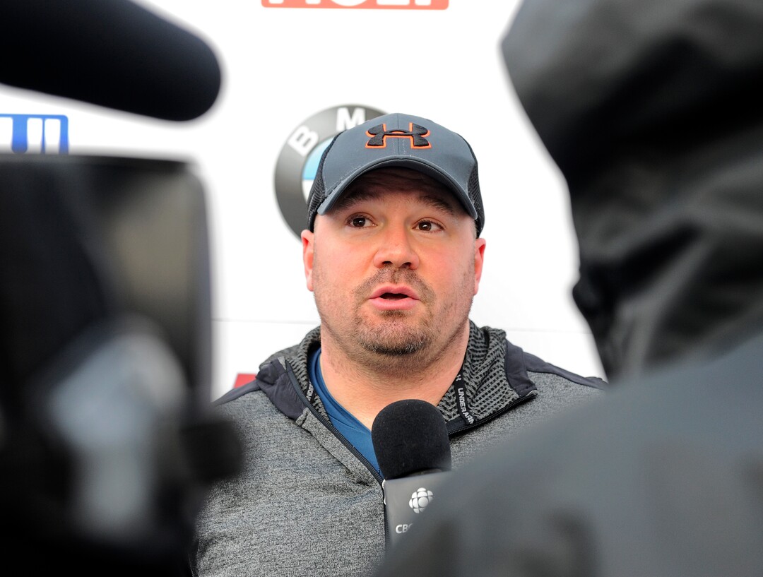 Driver Steven Holcomb, of the United States, talks with reporters in the finish area after winning the mens two-man bobsled World Cup race  on Friday, Dec. 16, 2016, in Lake Placid, N.Y. (AP Photo/Hans Pennink)


