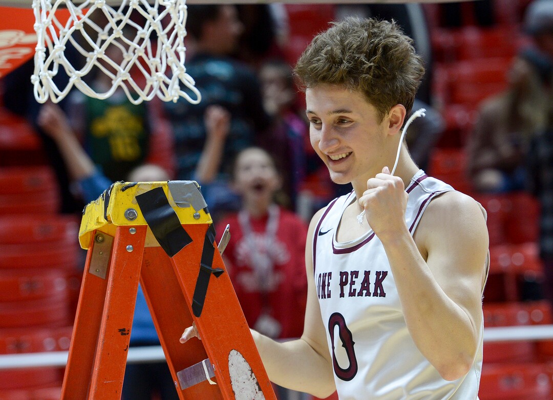 (Leah Hogsten  |  The Salt Lake Tribune) Lone Peak's Chantry Ross (00) cuts the net. Lone Peak defeated Pleasant Grove 61-44 to win the 6A High School BoysÕ Basketball Tournament Championship at the Jon M. Huntsman Center in Salt Lake City, Saturday, March 3, 2018. 