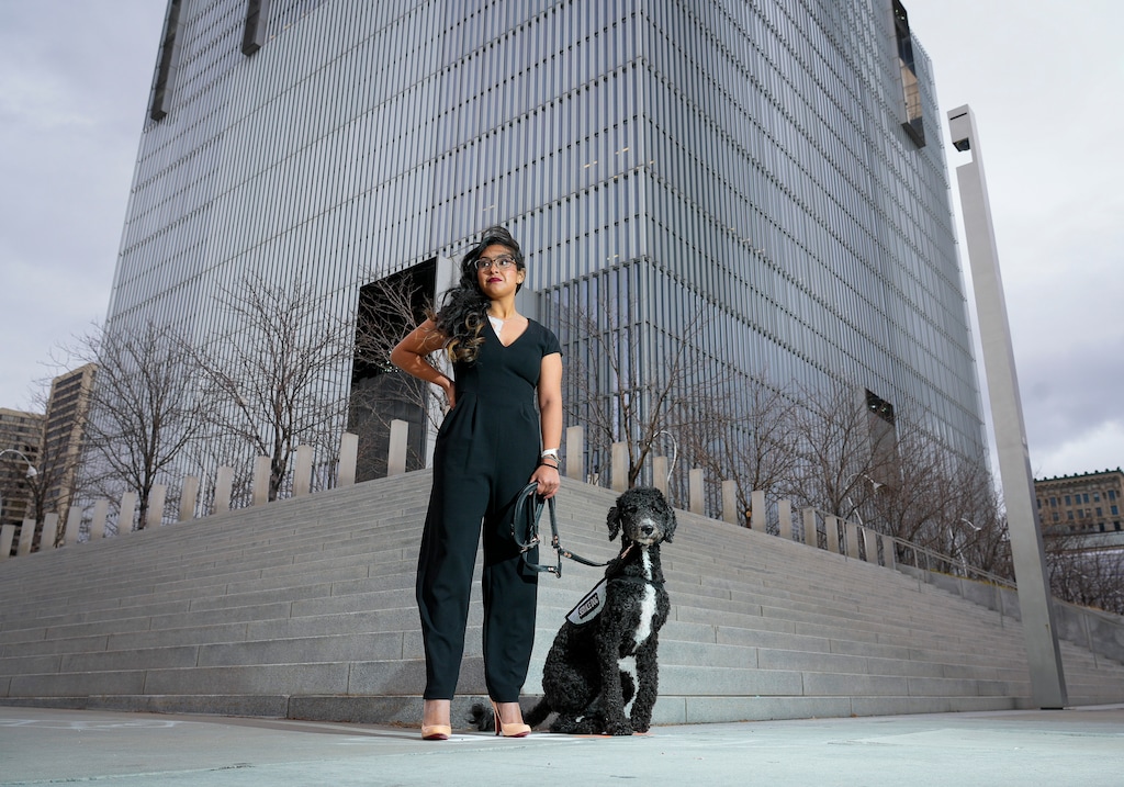 (Bethany Baker | The Salt Lake Tribune) Maria Thomson, who suffers from Postural orthostatic tachycardia syndrome or POTS, at the U.S. District Court in Salt Lake City, with her service dog, Daisy, on Monday, Feb. 5, 2024. After Thomson was expelled from Joyce University, she sued the school claiming they failed to provide proper accommodations for her disability.