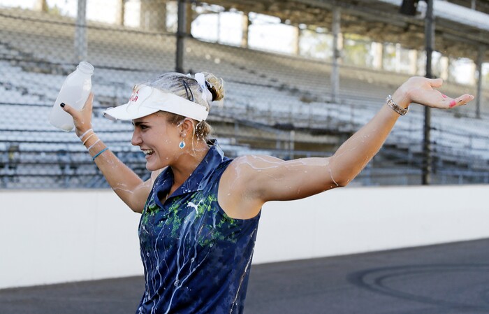 Lexi Thompson reacts after pouring milk over her head after winning the Indy Women in Tech Championship golf tournament, Saturday, Sept. 9, 2017, in Indianapolis. (AP Photo/Darron Cummings)