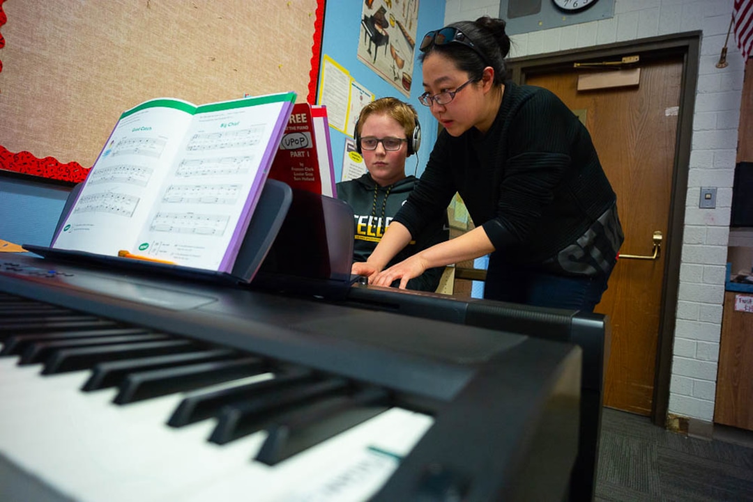 (Trent Nelson | The Salt Lake Tribune) Yuhuan Xu helps student Tyce Randall in the piano lab at Salt Lake City's Bennion Elementary, which might be closing due to low enrollment. The school district is holding a meeting  Tuesday Feb. 19, 2019 to discuss the issue and hear from parents.