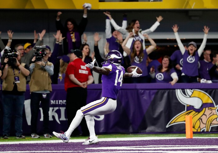 Minnesota Vikings wide receiver Stefon Riggs (14) runs in for a game winning touchdown against the New Orleans Saints during the second half of an NFL divisional football playoff game in Minneapolis, Sunday, Jan. 14, 2018. The Vikings defeated the Saints 29-24. (AP Photo/Jeff Roberson)