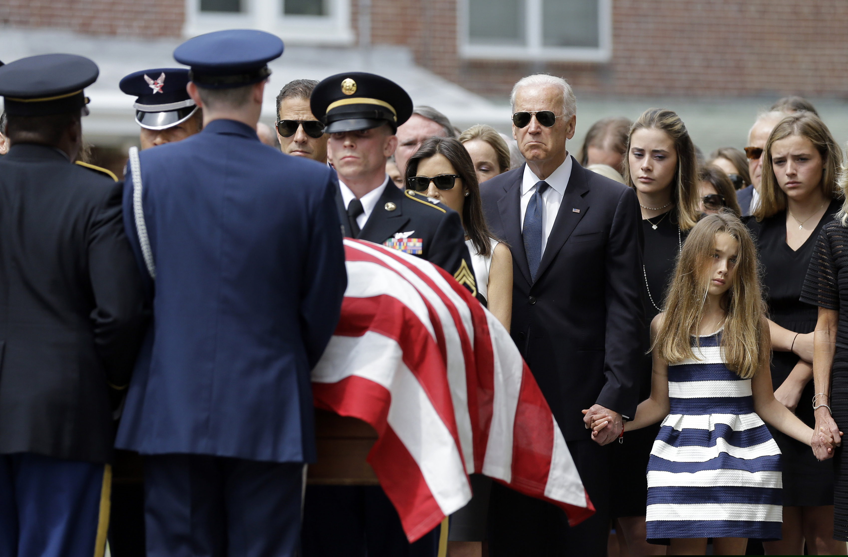 (Patrick Semansky | AP file photo)

In this June 6, 2015, photo, then-Vice President Joe Biden watches an honor guard carry a casket containing the remains of his son, former Delaware Attorney General Beau Biden, into St. Anthony of Padua Roman Catholic Church in Wilmington, Del. Standing alongside the vice president are Beau's widow Hallie Biden, left, and daughter, Natalie. Beau Biden died of brain cancer May 30. 2015, at age 46.