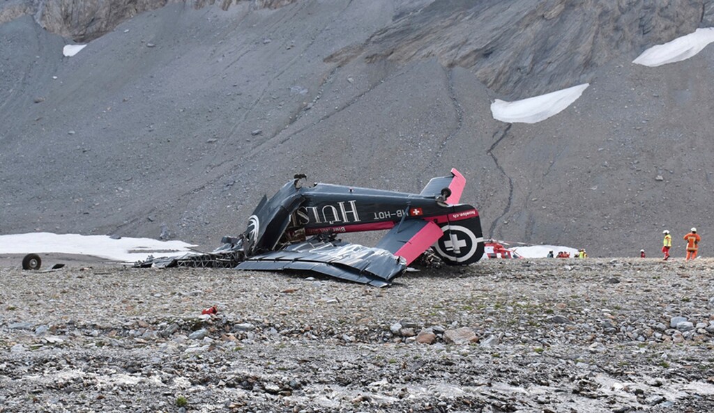The photo provided by Police Graubuenden shows the wreckage of the old-time propeller plane Ju 52  after it went down went down Saturday Aug, 4 2018 on the Piz Segnas mountain above the Swiss Alpine resort of Flims, striking the mountain's western flank about 2,540 meters (8,330 feet) above sea level.  All 20 people on board were killed, police said Sunday, Aug. 5, 2018.  (Polizei Graubuenden via AP)