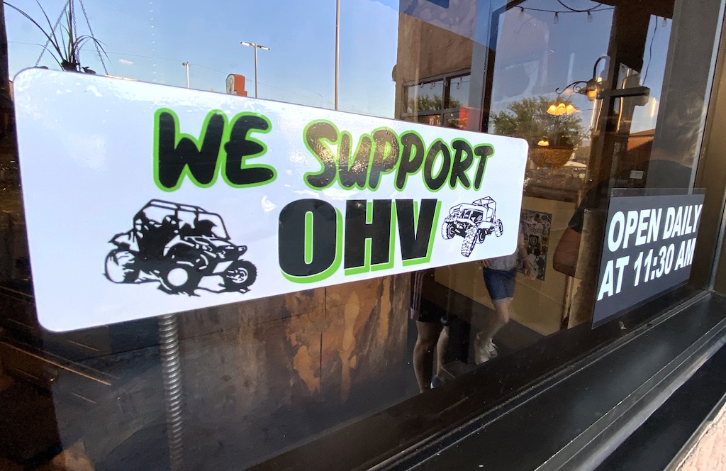 (Rick Egan | The Salt Lake Tribune) Stickers supporting the OHV were found on the windows of  a couple of business, in Moab, during the "Rally on the Rocks", on Friday, May 14, 2021.