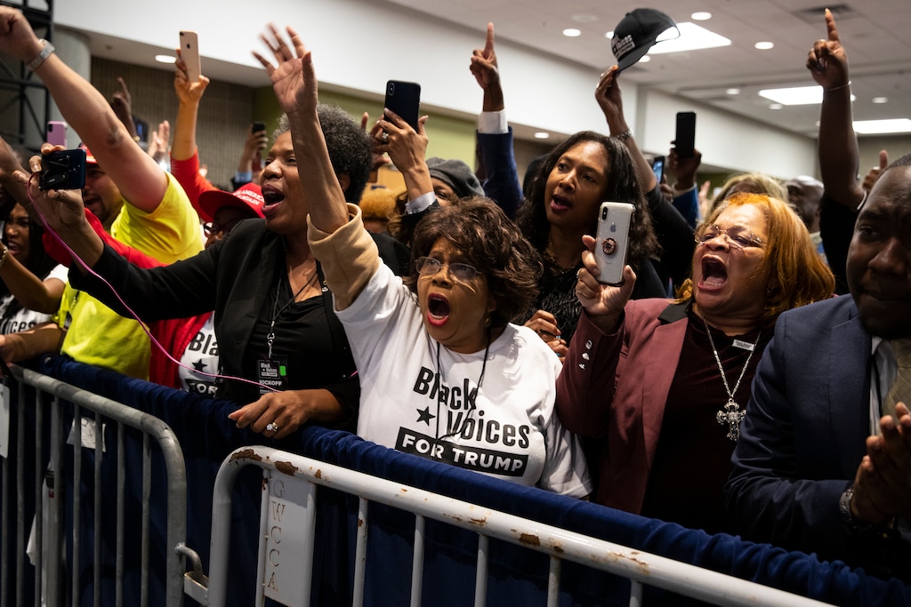 (Evan Vucci | AP) Supporters of President Donald Trump cheer as he arrives to speak during the launch of "Black Voices for Trump," at the Georgia World Congress Center, Friday, Nov. 8, 2019, in Atlanta.