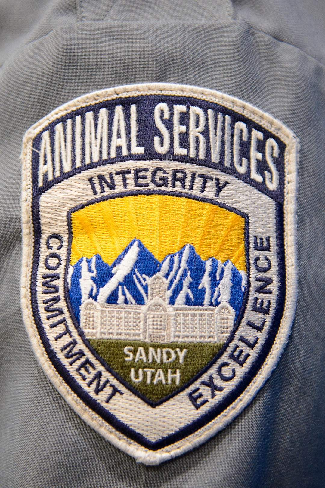 (Trent Nelson  |  The Salt Lake Tribune)  Officer Trevor Leslie displays the Sandy City Animal Services badge on Monday April 22, 2019.