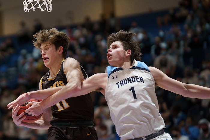 (Trent Nelson  |  The Salt Lake Tribune) Davis's Henry Ihrig and Westlake's Noah McCord as Davis defeats Westlake High School in the 6A boys basketball state championship game, in Taylorsville on Saturday, March 6, 2021.
