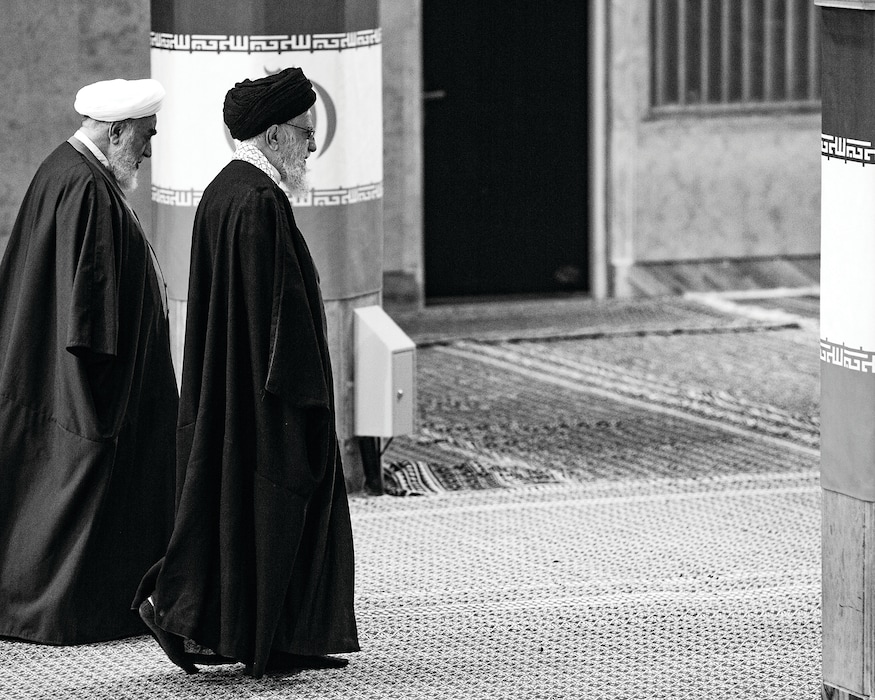 Iran's Supreme Leader Ayatollah Ali Khamenei walks next to his bureau chief Mohammed Mohammadi Golpajegani after casting his ballot during the Iranian Parliamentary and Assembly of Experts elections in Tehran, Iran, on March 1, 2024. (Arash Khamooshi/The New York Times)