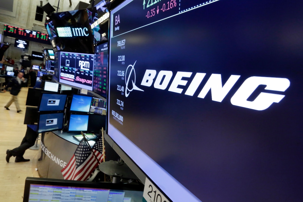 In this Monday, July 24, 2017, photo, the Boeing logo appears above a trading post on the floor of the New York Stock Exchange. The Boeing Co. reports earnings, Wednesday, July 26, 2017. (AP Photo/Richard Drew)
