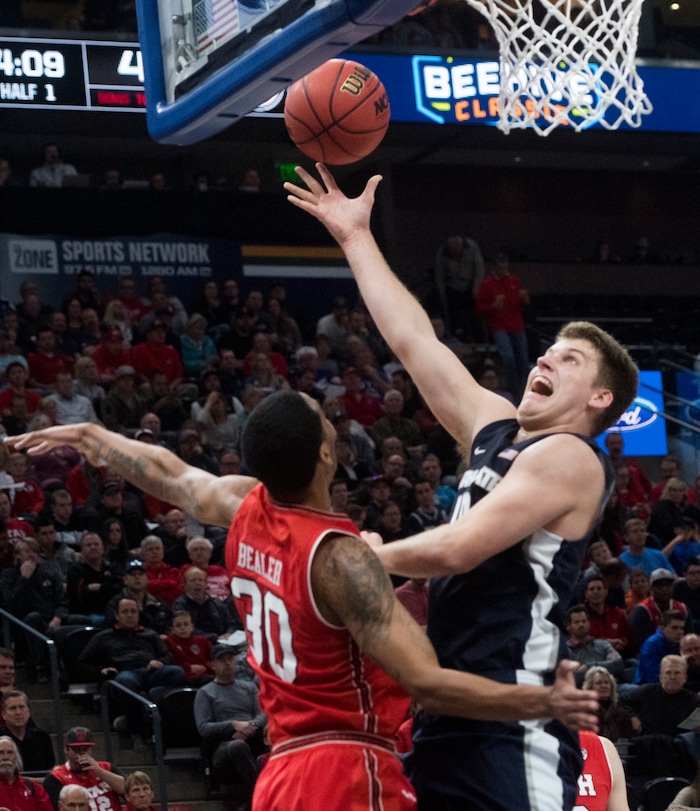 (Rick Egan  |  The Salt Lake Tribune)  Utah State Aggies forward Quinn Taylor (10) shoots as Utah Utes guard Gabe Bealer (30) defends, in Beehive Classic basketball action at the Vivint SmartHome Arena, Saturday, December 9, 2017.