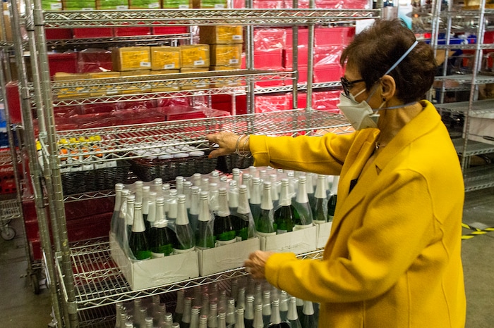 (Rick Egan | The Salt Lake Tribune)  Maxine Turner, founder of Cuisine Unlimited, checks inventory in the warehouse on Wednesday, Nov. 25, 2020.