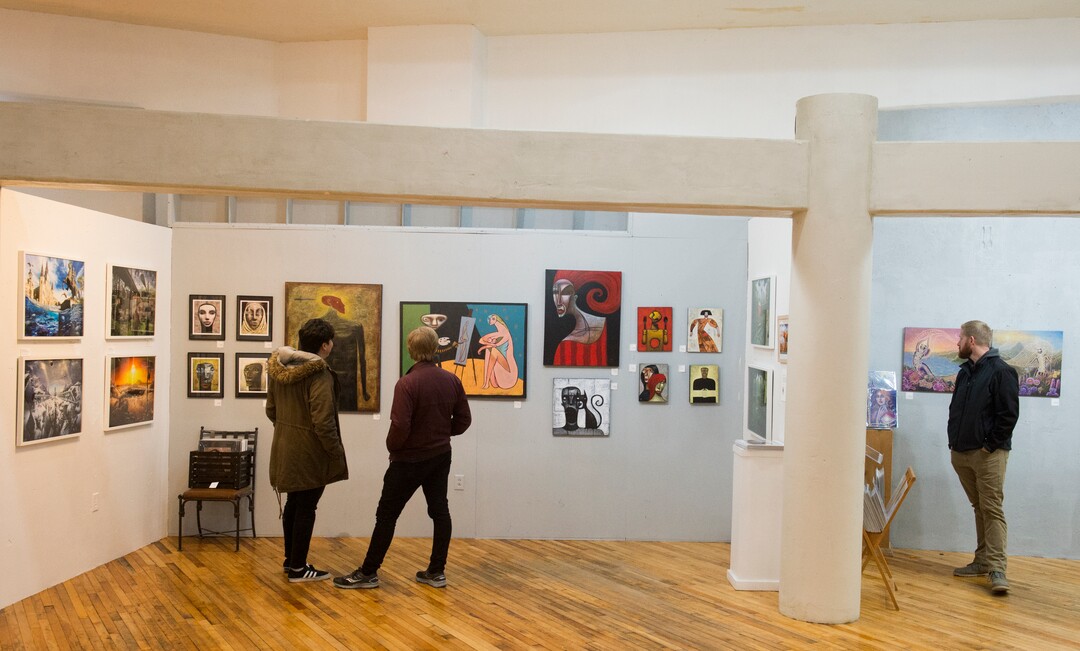 (Rick Egan  |  The Salt Lake Tribune)      Participants of the monthly gallery stroll, check out the art at the Urban Arts Gallery, on Rio Grande Street, Friday, Nov. 16, 2018.