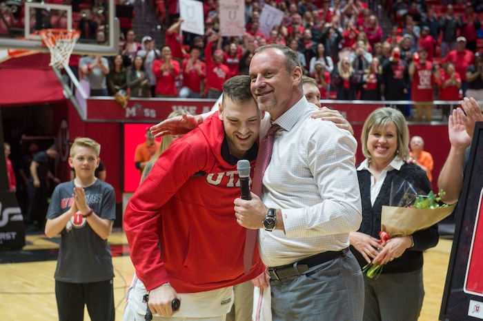 (Rick Egan  |  The Salt Lake Tribune)  Utah Utes head coach Larry Krystkowiak hugs Utah Utes forward David Collette as he makes it back out on to the court to be honored on senior night.  Collette was injured earlier in the game, in PAC-12 basketball action between Utah Utes and Colorado Buffaloes, at the Jon M. Huntsman Center, Saturday, March 3, 2018.