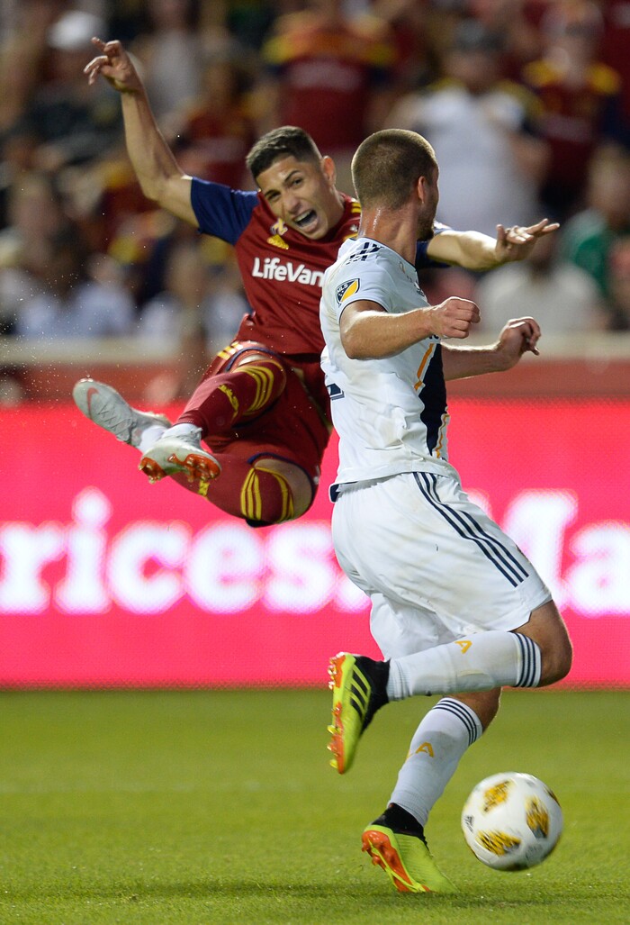 (Francisco Kjolseth  |  The Salt Lake Tribune)  Real Salt Lake forward Jefferson Savarino (7) attempts a shot on goal past Los Angeles Galaxy defender Perry Kitchen (2) during the first half of the MLS soccer match Saturday, Sept. 1, 2018, in Sandy at Rio Tinto Stadium.