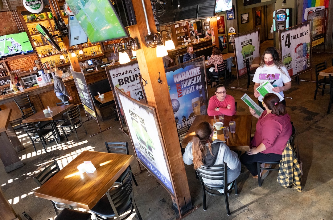 (Francisco Kjolseth  | The Salt Lake Tribune) Annie Dinneen takes lunch orders from the limited clientele during the lunch hour at the Green Pig Pub on Thursday, Dec. 3, 2020.