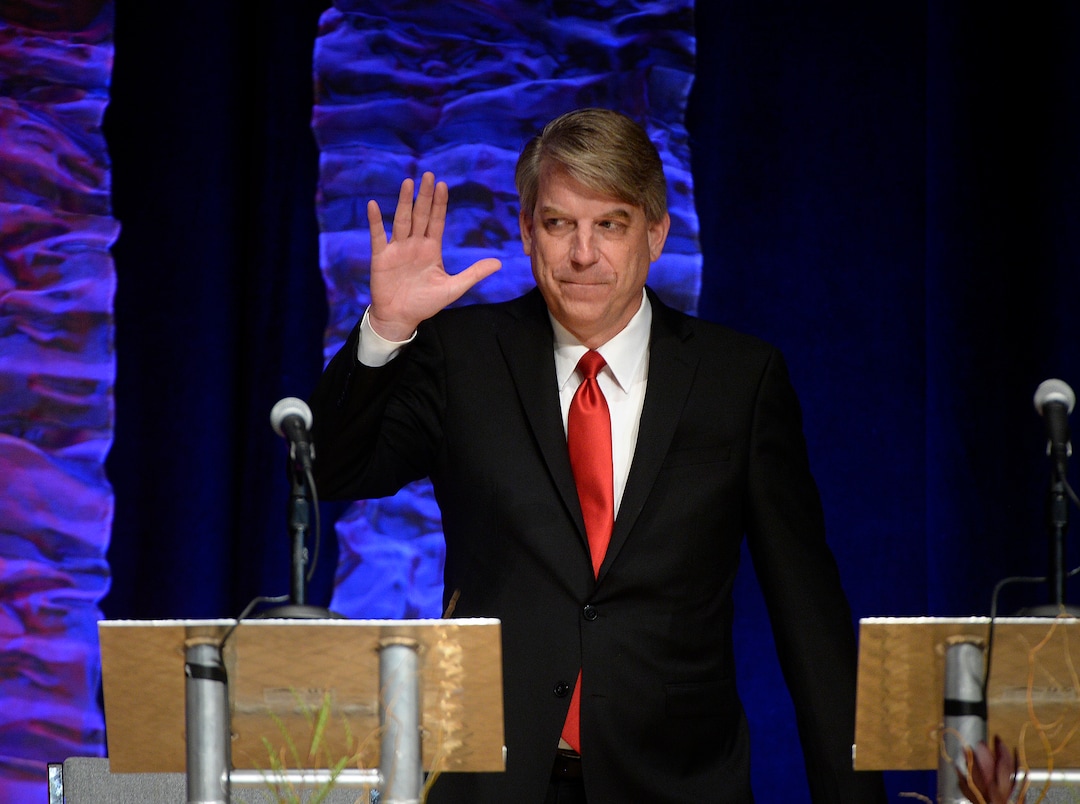 (Scott Sommerdorf   |  The Salt Lake Tribune)   Jim Bennett waves as he is introduced as Utah's 3rd District Congressional debate began, Friday, October 13, 2017. 