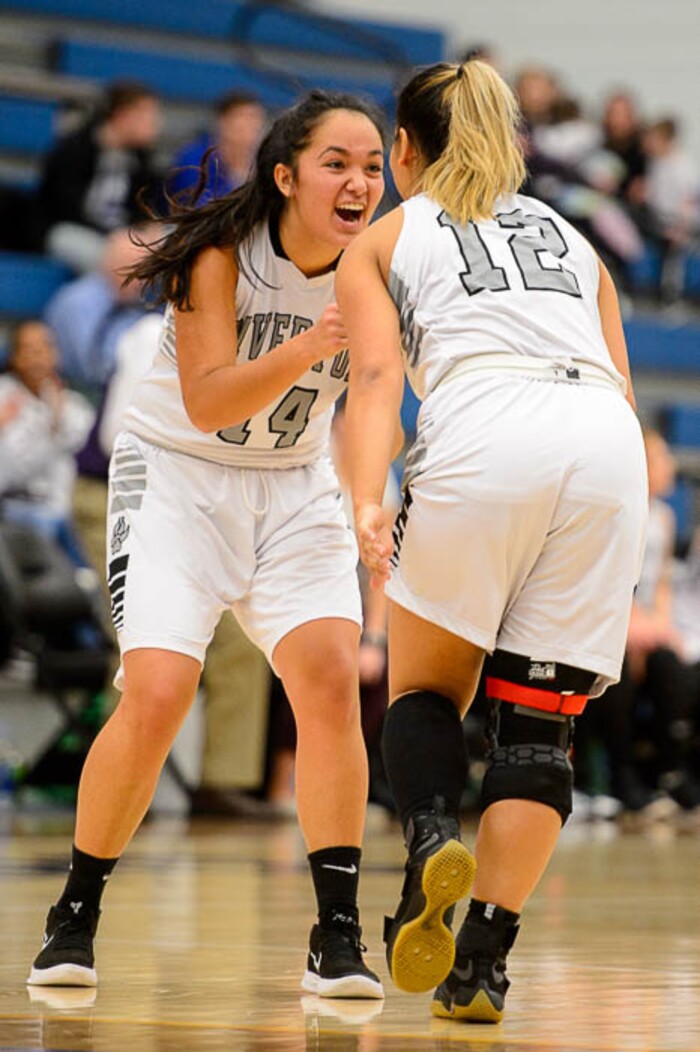 (Trent Nelson | The Salt Lake Tribune)  Riverton's Kaitlin Burgess (14) and Riverton's Jaydeene Burgess (12) celebrate a double-digit lead as Riverton faces American Fork in the 6A High School Girls' Basketball Tournament at SLCC in Taylorsville, Tuesday Feb. 20, 2018.