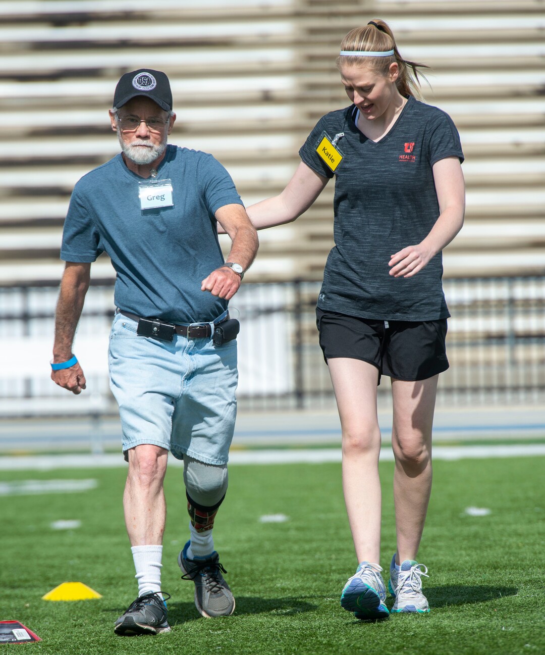 (Rick Egan  |  The Salt Lake Tribune)    Greg Balliaine from Sandy, is assisted by Katie Johnson from the University of Utah, during the fourth annual Utah Adaptive Mobility Clinic at Skyline High school. The clinic allows anyone with "lower extremity limb loss or limb difference" or amputees without legs, to practice walking and running. Saturday, June 1, 2019.