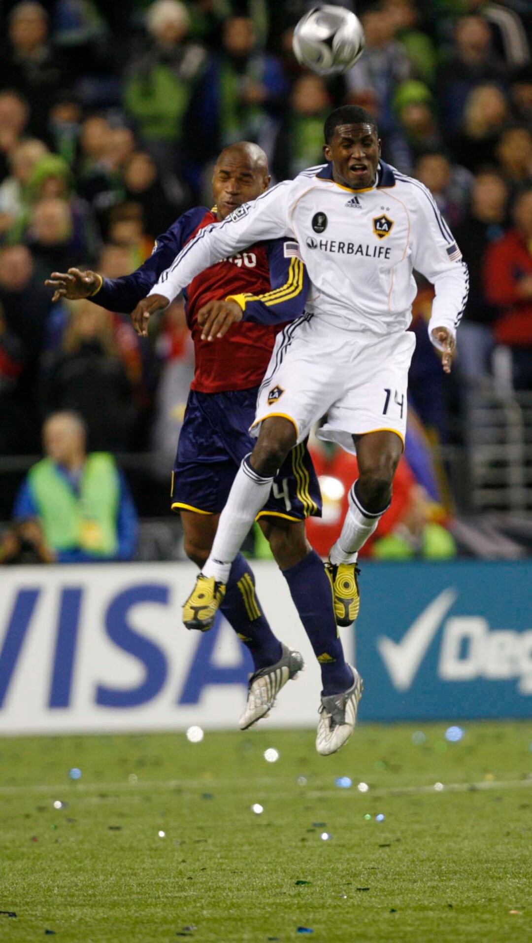 (Trent Nelson  |  Tribune file photo) L.A. Galaxy's Edson Buddle, right, and Real Salt Lake defender Jamison Olave (4) play during the MLS Cup on Sunday at Qwest Field in Seattle. RSL won the cup 5-4 during the penalty round.