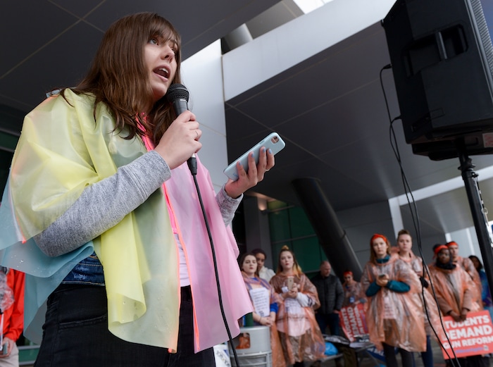 (Leah Hogsten | The Salt Lake Tribune) "I was a victim of the fear, pain and horror," said Jolie Martin, a Woods Cross senior, who lived near Aurora, CO in 2012 at the age of 12 and was a patron of the movie theater that was the scene of the 2012 mass shooting that killed 12 and injured 70. In her address to Utah's Congressmen and woman, Martin said "We will vote you out and find people who will make us safe." Demonstrators in support of gun reform at the Wallace F. Bennett Federal Building downtown during the #TownHallForOurLives march, Saturday, April 7, 2018, in response to a national call for town hall meetings issued by David Hogg, one of the leaders of the Parkland, FL #NeverAgain movement.