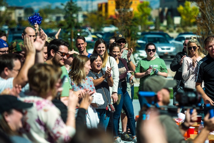 (Chris Detrick | The Salt Lake Tribune) Spectators cheer as fellow employees compete in a pizza eating competition during a fundraiser for United Way at CHG Healthcare Wednesday, September 20, 2017.