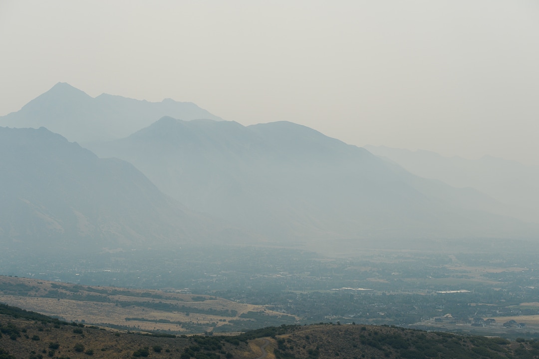 (Francisco Kjolseth  |  The Salt Lake Tribune)  Mount Timpanogos stands higher than the rest as thick smoke envelops the mountains and Utah county with poor air quality as crews continue to battle the Coal Hollow fire near Highway 6 on Saturday, Aug. 11, 2018.