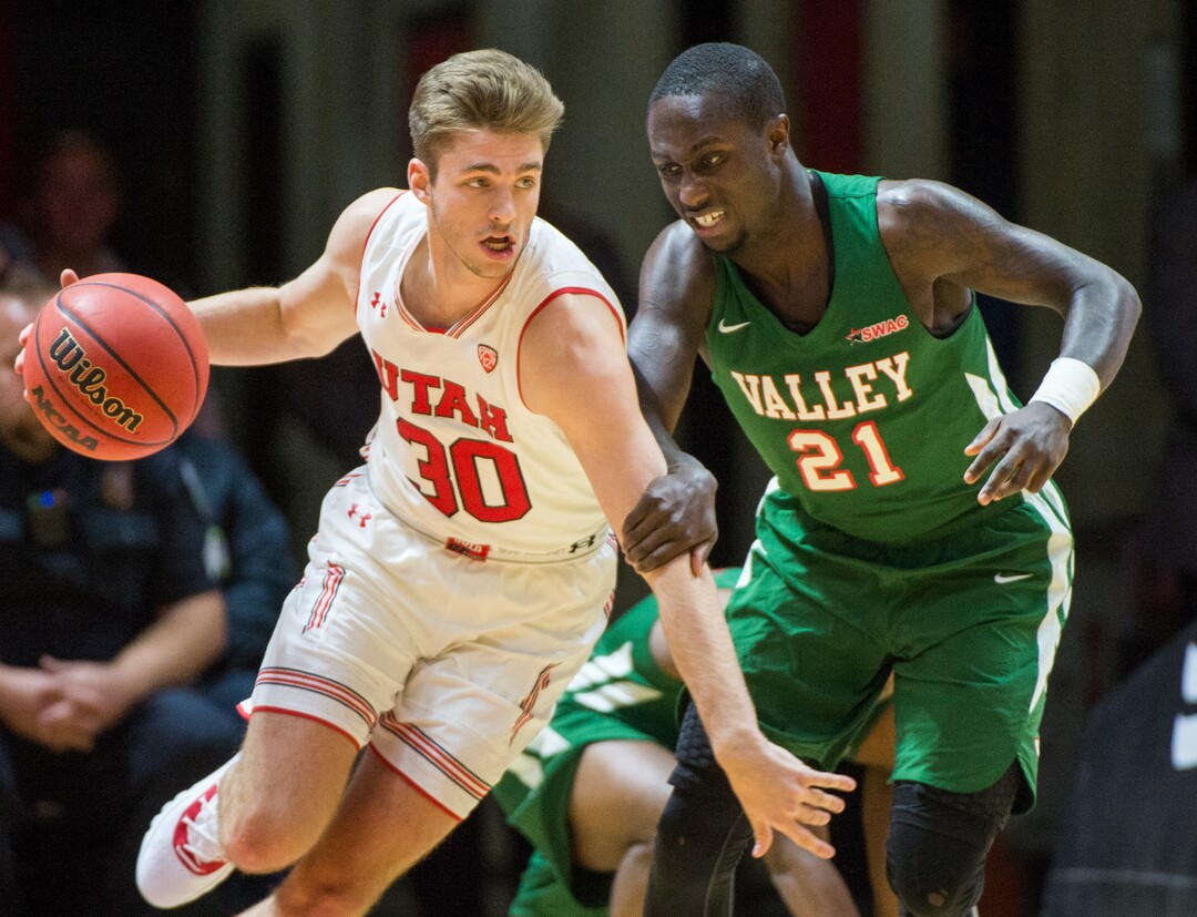 (Rick Egan  |  The Salt Lake Tribune)    Utah guard Brooks King (30) leads a fast break for the Utes, as Mississippi Valley State Delta Devils guard Patrick Rucker (21) defends, in basketball action between Utah Utes and Mississippi Valley State Delta Devils at the Jon M. Huntsman Center, Thursday, Nov. 15, 2018.