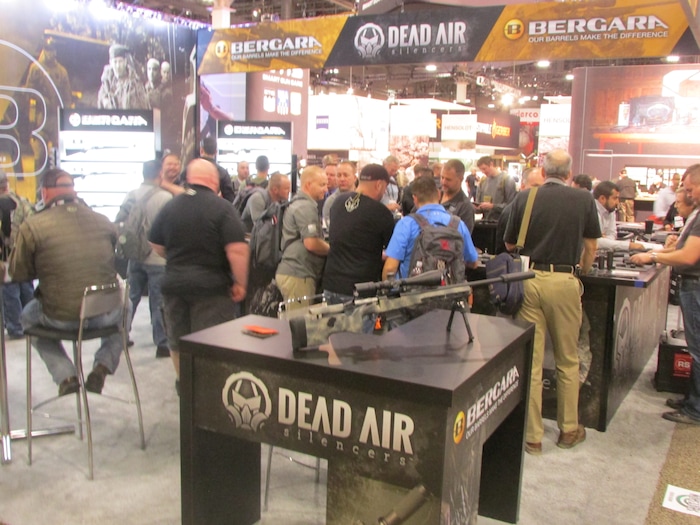 (Tom Wharton | Special to The Tribune) Potential buyers examine products Jan. 23, 2018, at the SHOT Show in Las Vegas.