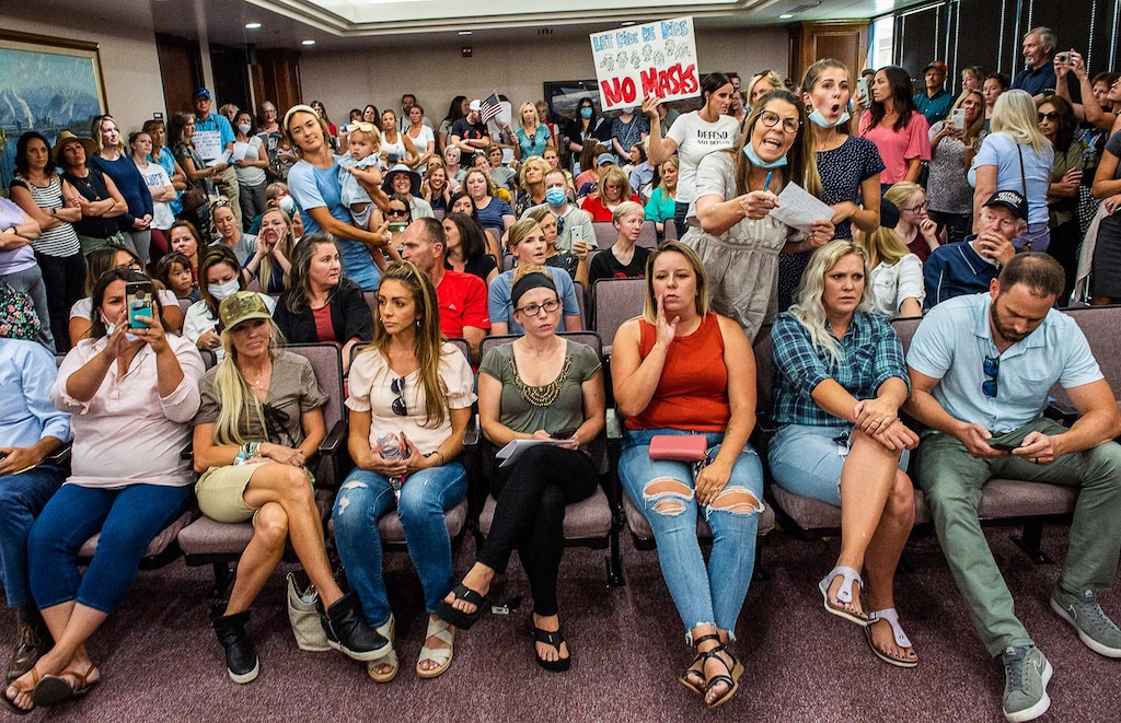 (Rick Egan | The Salt Lake Tribune) Angry residents react when a Utah County Commission meeting on July 15 is adjourned before it even started. The group protesting against face masks being required in schools filled the meeting room, prompting Commissioner Tanner Ainge to say it was an unsafe gathering.