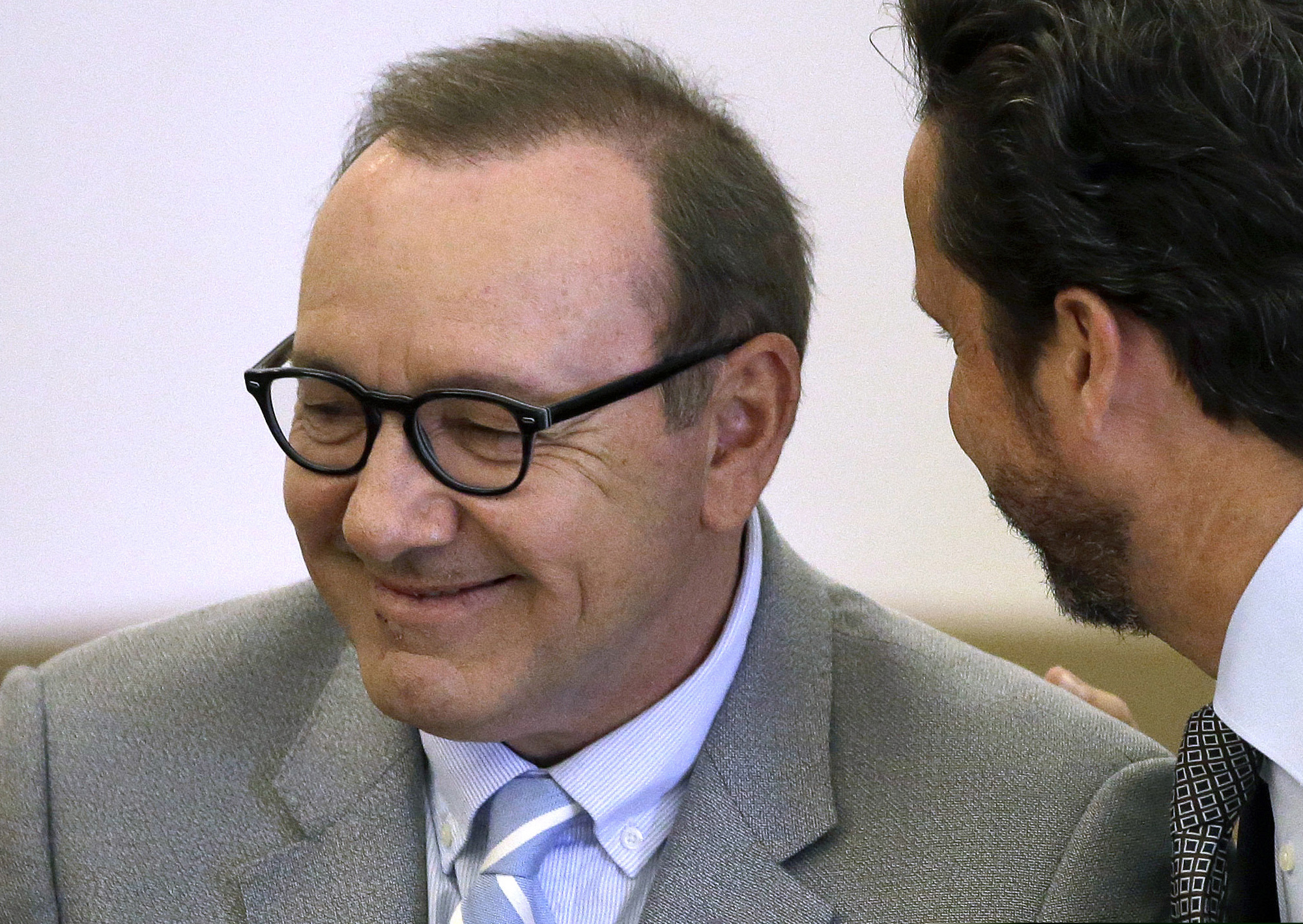 (Steven Senne | AP Photo) In this June 3, 2019 photo, actor Kevin Spacey listens to attorney Alan Jackson during a pretrial hearing at district court in Nantucket, Mass. On Wednesday, July 17, prosecutors dropped the sexual assault case against Oscar-winning actor, who had been accused of groping 18-year-old man in 2016 in the crowded bar at the Club Car in Nantucket.